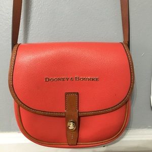 A orange Dooney & Bourke bag